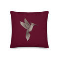 Product mockup - Hummingbird on a berry background pillow.