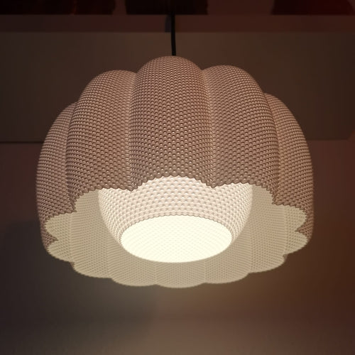 Textured pendant light fixture on a dark background