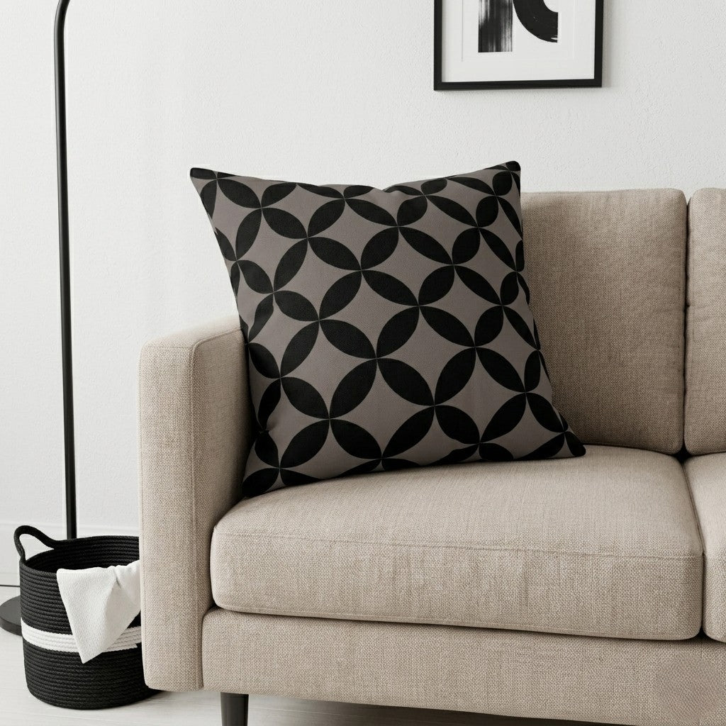 Beige sofa with a decorative pillow featuring a geometric pattern in Chocolate in a minimalistic living room.