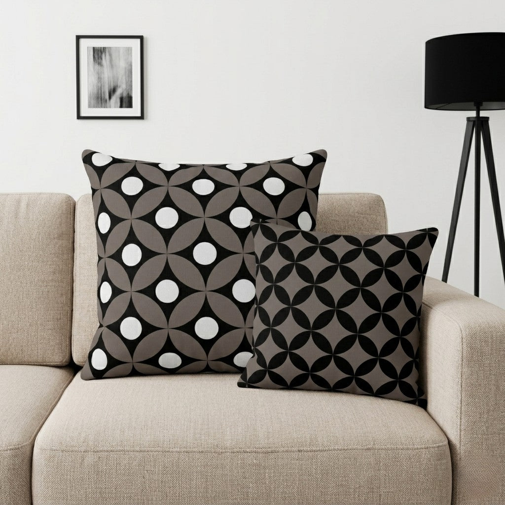 Decorative pillows with geometric patterns in Coffee and Chocolate on a beige sofa.