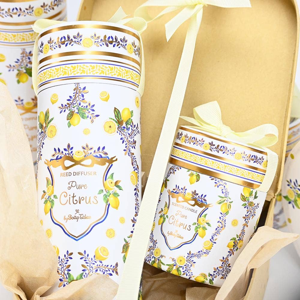Decorative diffuser and pouch wrapped in bows with lemon and floral design on a yellow background