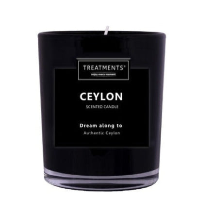 Black candle labeled 'Ceylon' by Treatments on a white background