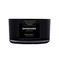 Black scented candle labeled 'Shinshiro' by Treatments on a white background