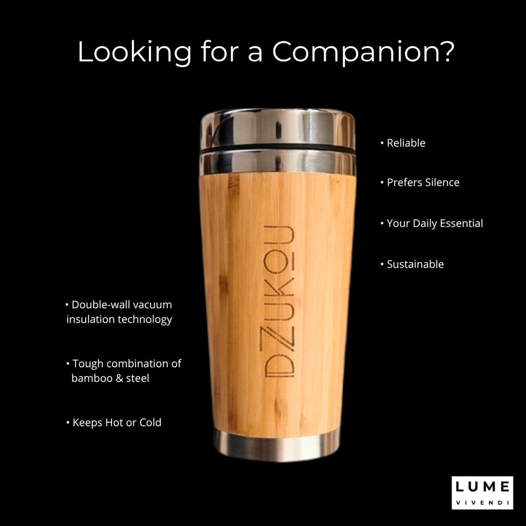 Wooden travel mug with metallic lid on a black background, featuring text about product features.